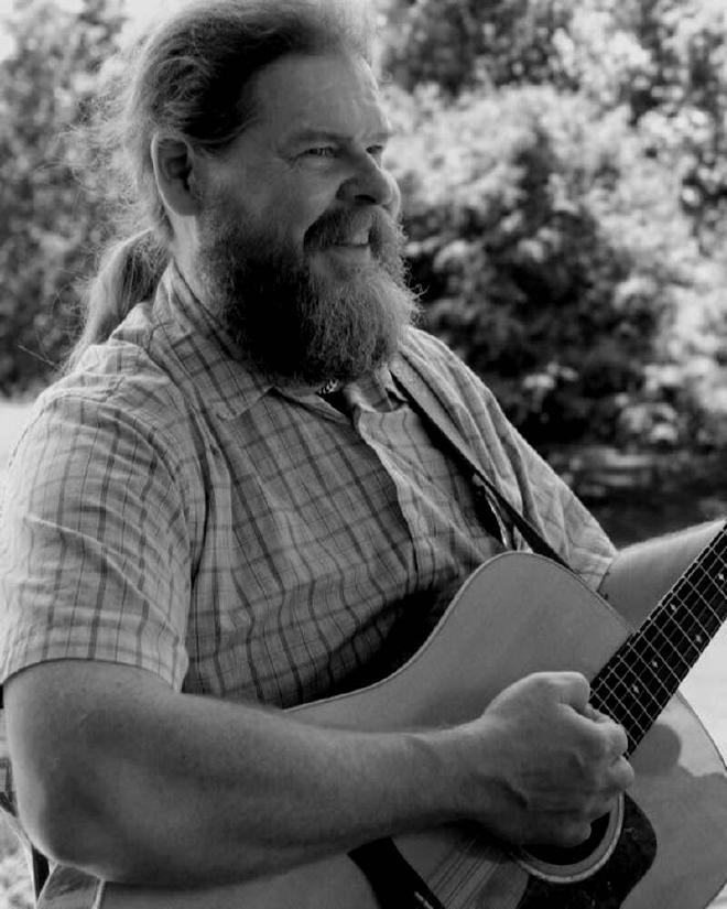 Rusty playing guitar outdoors