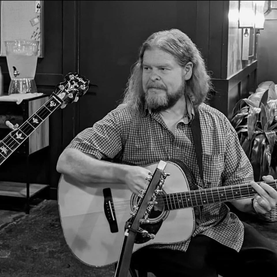 Rusty playing guitar
